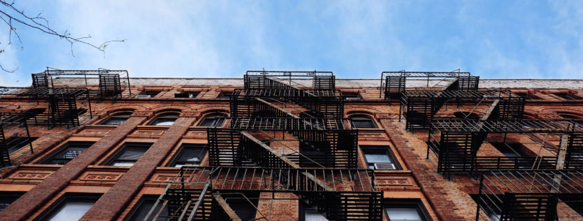 looking up at a new york city condo building